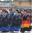 Yi dancers in colorful outfits