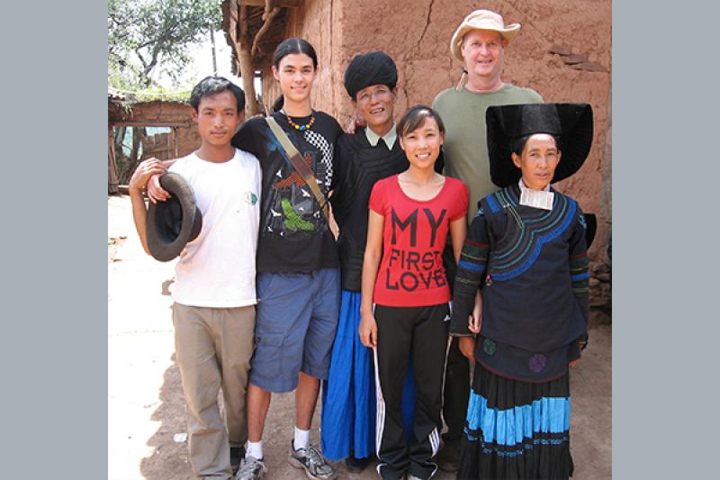 Professor Mark Bender (top right) with his son Marston and epic singer Jjivot Zopqu during fieldwork on Nuosu Yi epic "The Book of Origins."