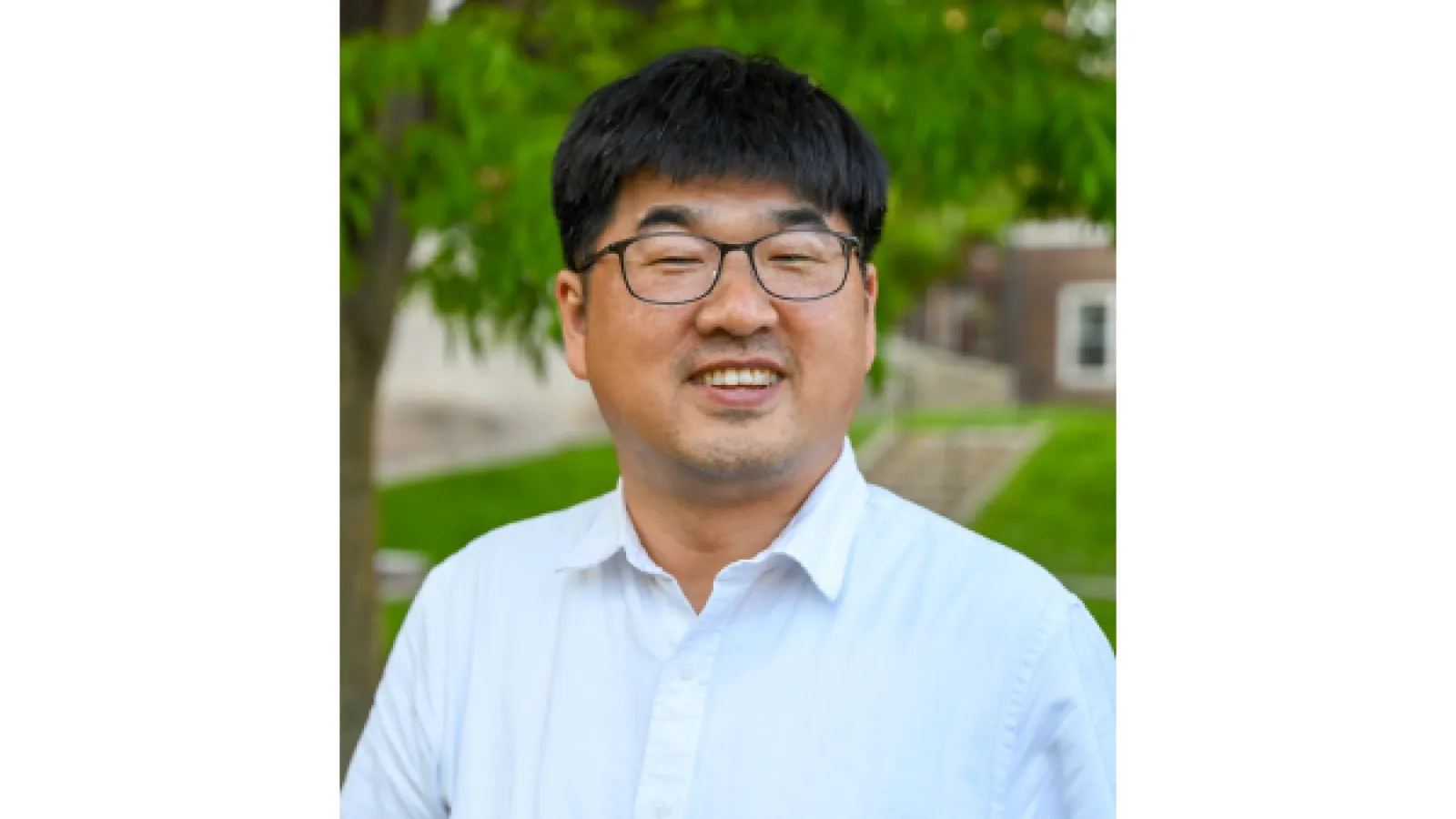 Headshot of Hyunjoon Park, a man with black hair and glasses in a light blue button down