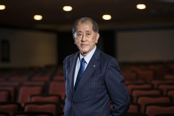 Aiji Tanaka in front of an empty theatre