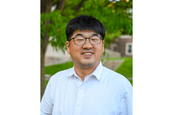 Headshot of Hyunjoon Park, a man with black hair and glasses in a light blue button down