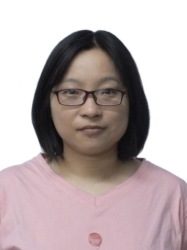 Smiling woman with glasses and a pink shirt