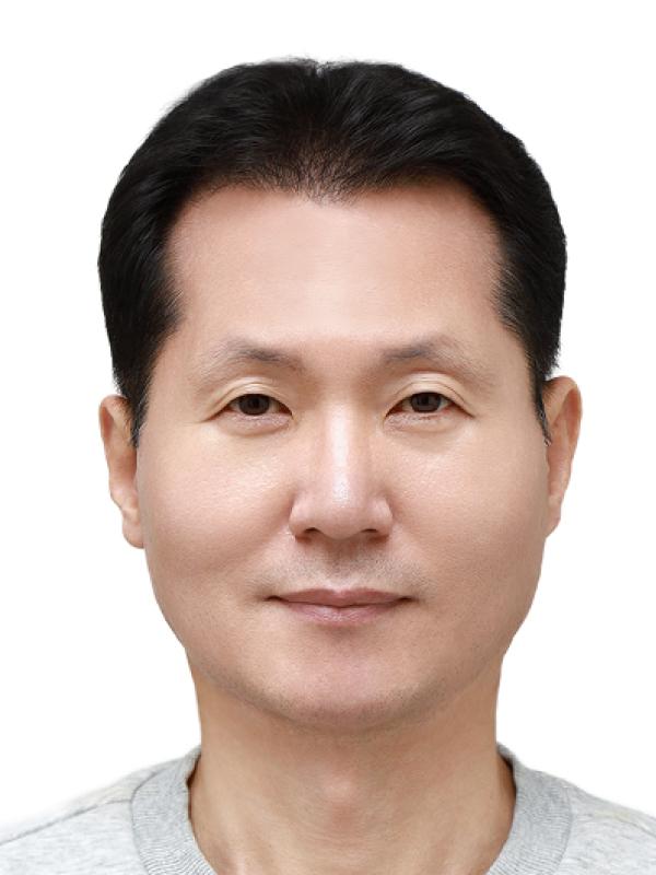 Man with dark hair and friendly smile