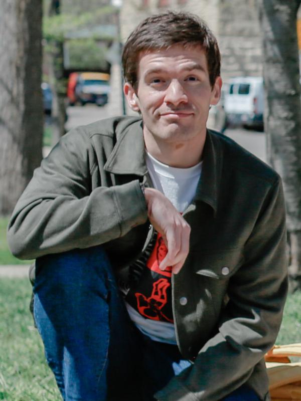 Man with dark hair and friendly smile